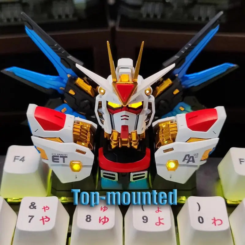 Close-up of Strike Freedom Gundam emblem on artisan keycap for keyboard customization